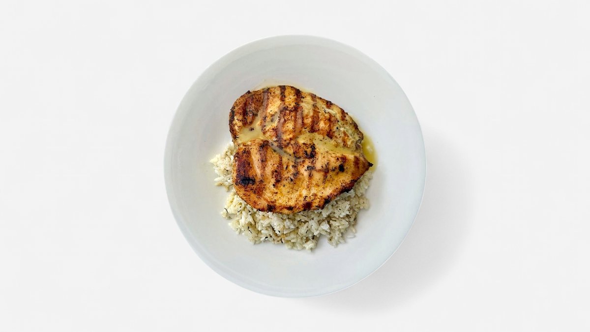 Grilled chicken fillet over dill rice with lemon sauce at Cookaki Athens