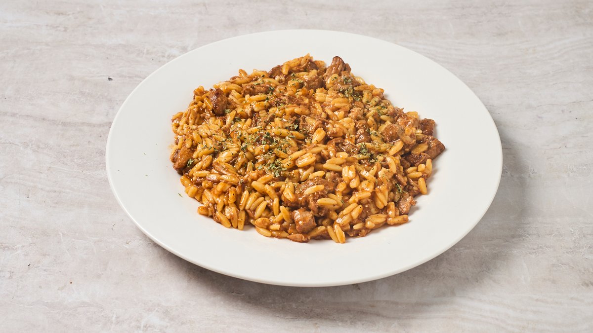 Greek beef kokkinisto braised in tomato sauce served with kritharaki orzo at Cookaki Athens